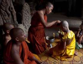 A young boys initiation into the Buddhist monk-hood ceremony at Angkor Wat Fine Art Travel Photography For-Sale online 