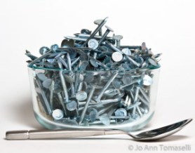 A Glass Bowl filled with nails and a silver spoon Image Art by Fine Art Photographer Jo Ann Tomaselli